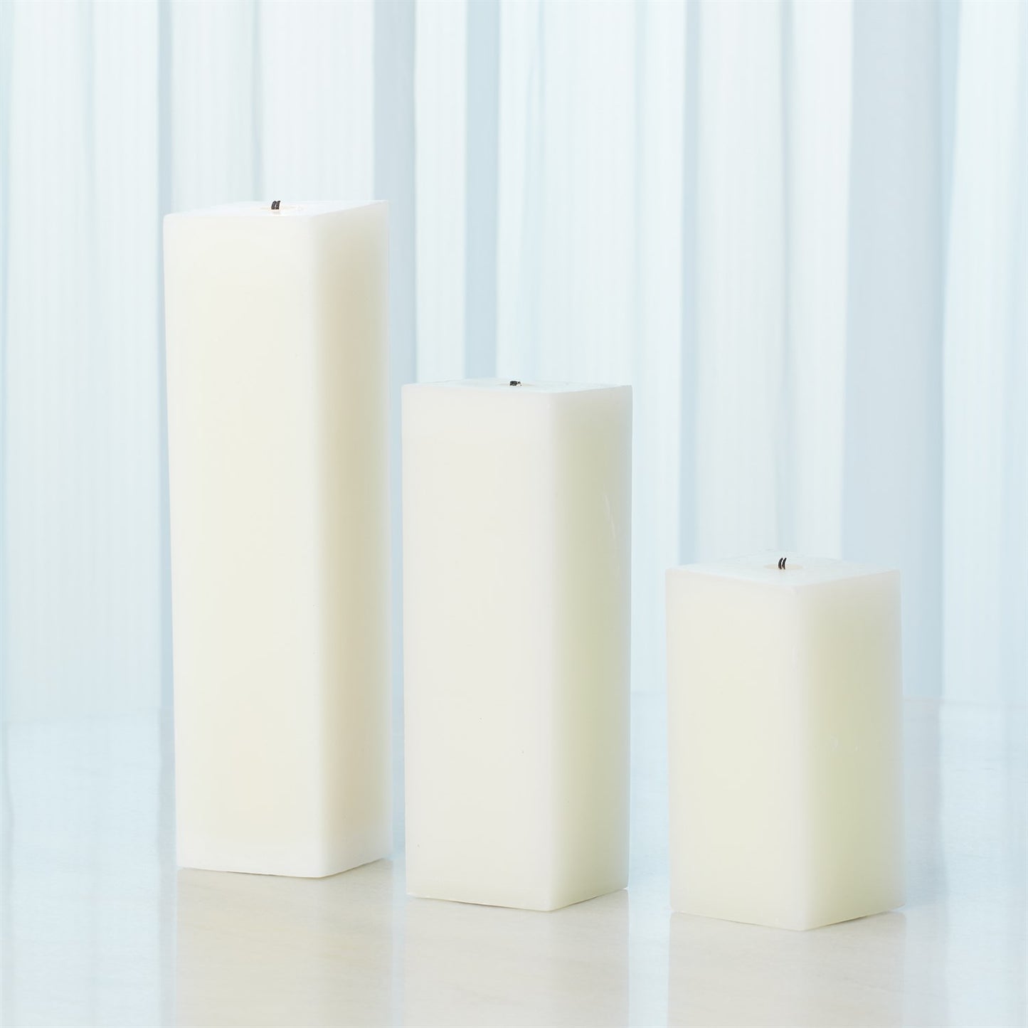 Square Pillar Candle - A versatile Square Pillar Candle from GRACE BLU SHOPPE, creating a warm and inviting atmosphere in your space.
