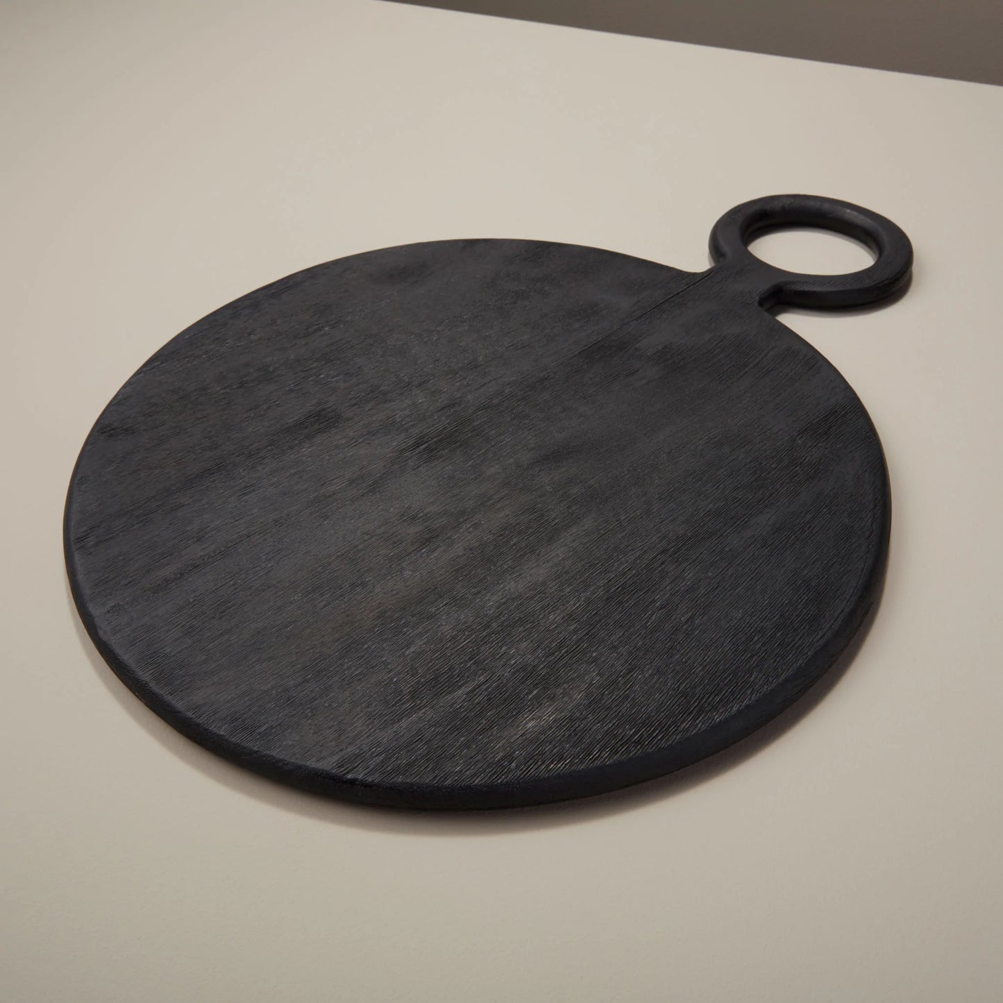The Myla Black Mango Board - An elegant and versatile The Myla Black Mango Board from GRACE BLU SHOPPE, perfect for serving or as a decorative accent.
