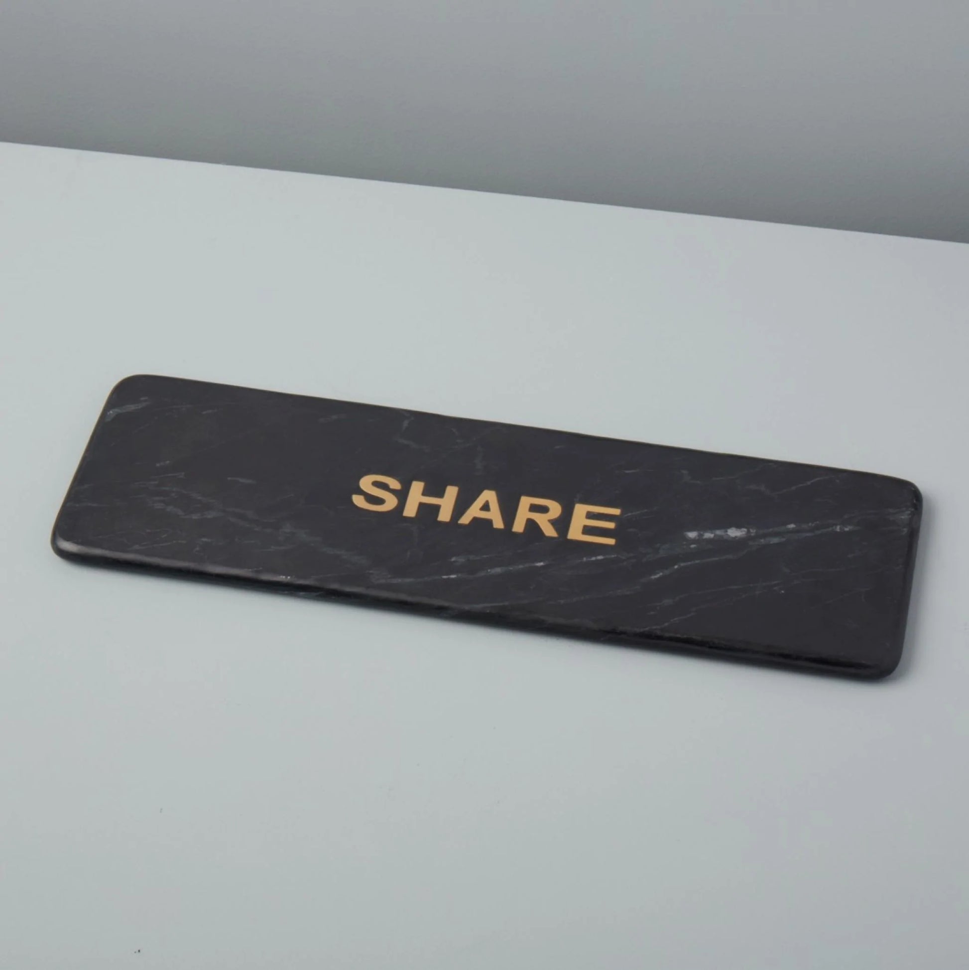 "Share" Black Marble Serving Board: Elegant black marble serving board with "Share" engraving from Grace Blu Shoppe, perfect for hosting gatherings.