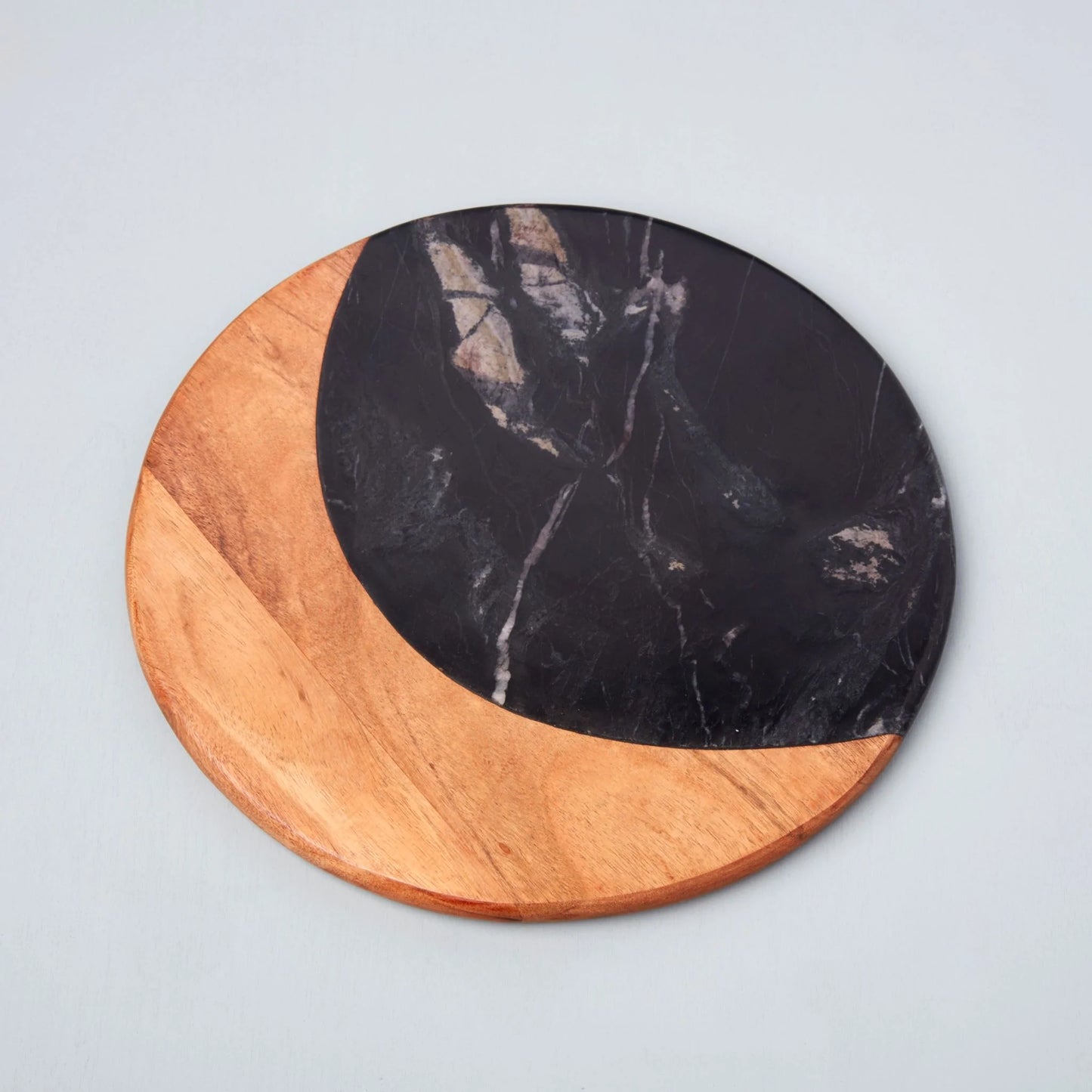Helena Black Marble Round Board: Sophisticated Helena black marble round board from Grace Blu Shoppe, perfect for serving charcuterie or as a stylish centerpiece.